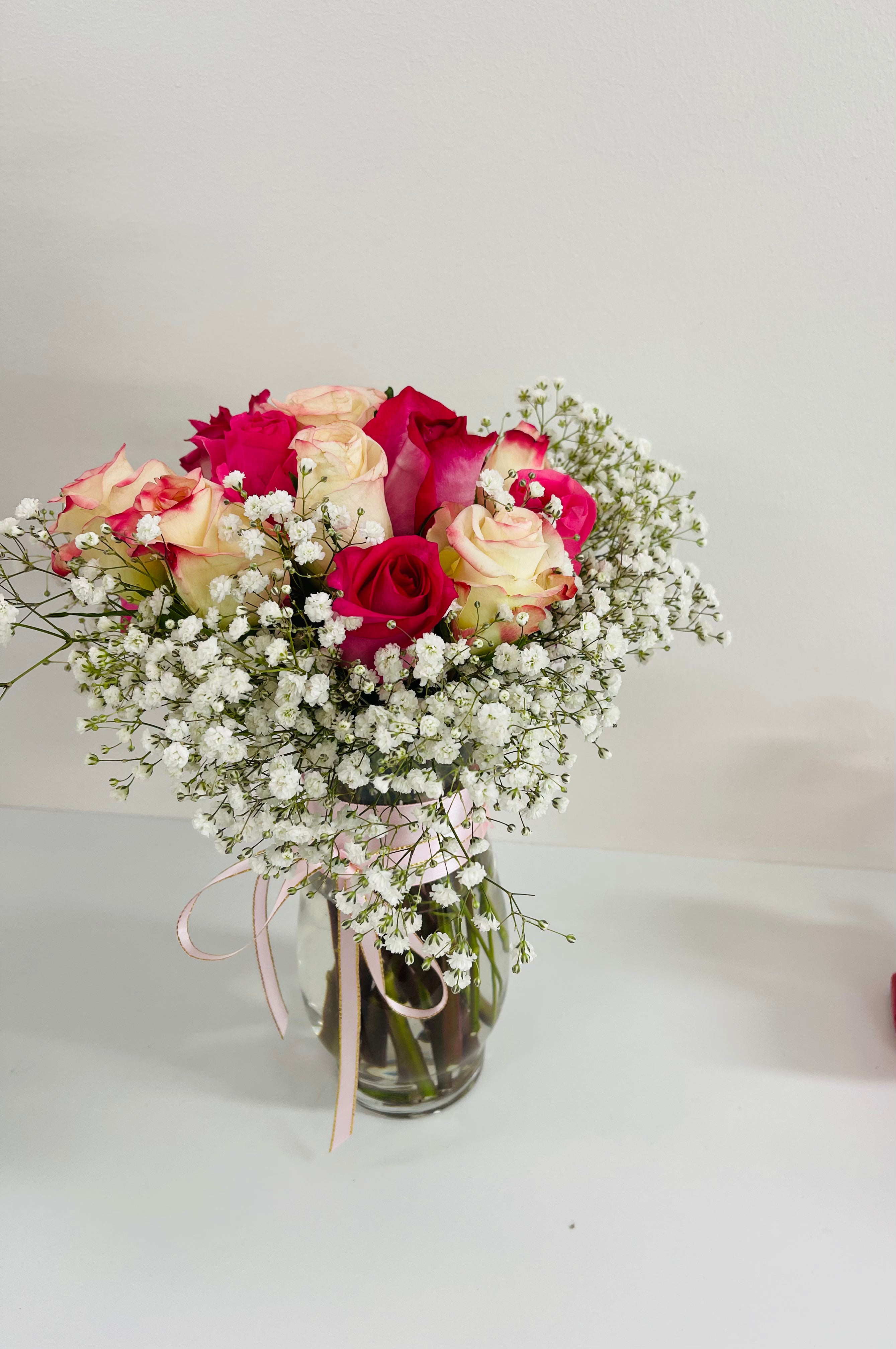 Pink and white roses vase with baby breath