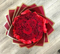 Dozen red roses wrapped