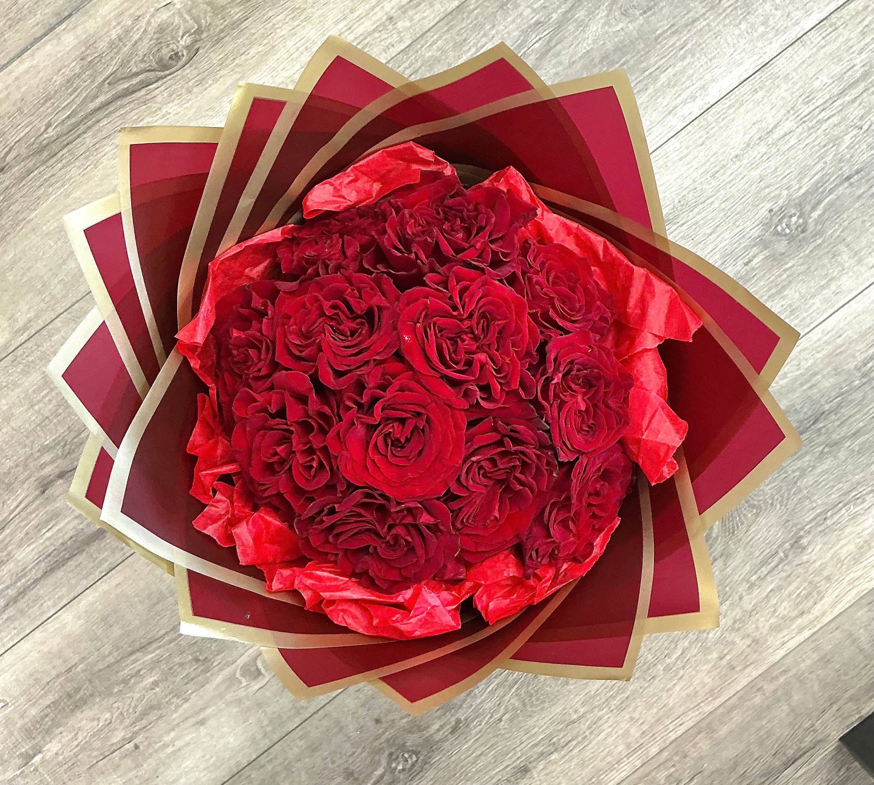 Dozen red roses wrapped